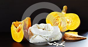 Pumpkin seeds and cut pieces of vegetable photo