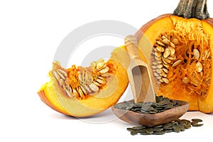 Pumpkin seeds and fresh pumpkin isolated on white
