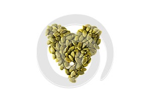 Pumpkin seeds heart shape, on a white background, isolated. Healthy vegetarian snack. Love vegetarian food. Loose weigh or fitness