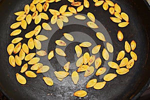 Pumpkin seeds on the pan (close up)