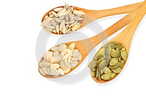 pumpkin seeds ,Peeled Sunflower seeds,Melon Seeds in wooden spoon isolated on white background