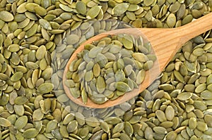 Pumpkin seeds with spoon photo