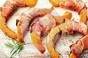 Pumpkin slices wrapped in bacon