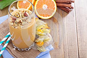 Pumpkin smoothie with granola on top