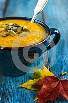 Pumpkin soup on a bowl