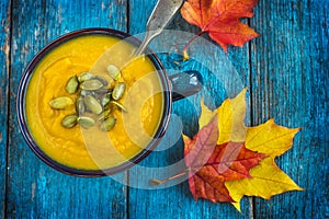 Pumpkin soup on a bowl