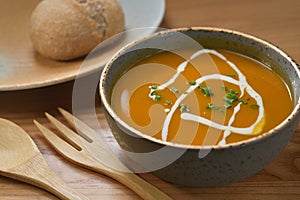 Pumpkin soup cream topping and cutlery set