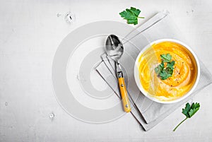 Pumpkin soup with parsley background