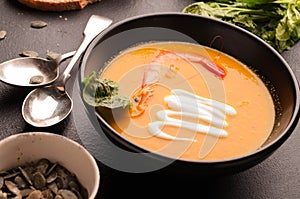 Pumpkin soup with prawn and sour in bowl