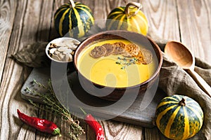 Pumpkin soup with seeds, spices, herbs and croutons