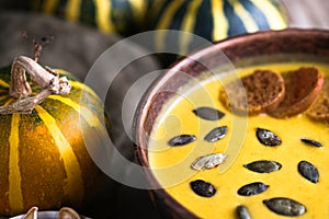 Pumpkin soup with seeds, spices, herbs and croutons