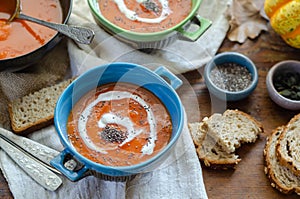 Pumpkin soup served  in bowl on the table