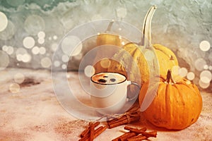 Pumpkin spice latte with cinnamon and bokeh
