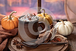 Pumpkin spice latte with autumn background