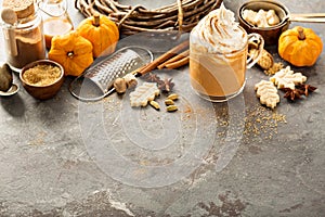 Pumpkin spice latte in a glass mug