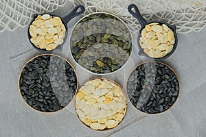 Pumpkin and sunflower seeds in bowl. Dried cereal seeds and fruits. Food ingredients