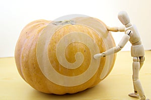 Pumpkin on a table with a manequin