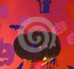 Pumpkins and bats decorations. Halloween celebration with trick or treat, copy space. Halloween and party concept. Male