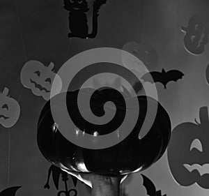 Pumpkins and bats decorations. Halloween celebration with trick or treat, copy space. Halloween and party concept. Male