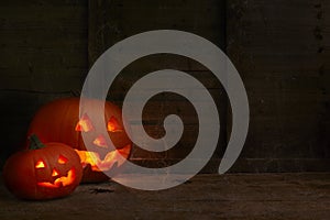 pumpkins on a dark wooden cobweb background