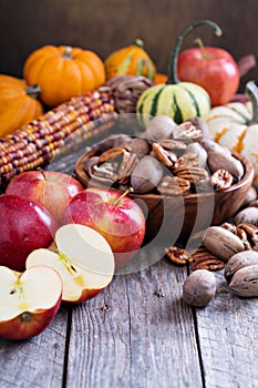 Pumpkins, nuts, indian corn and apples