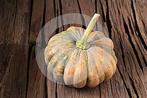 pumpkins on old wooden boards background Closeup