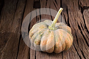 pumpkins on old wooden boards background Closeup
