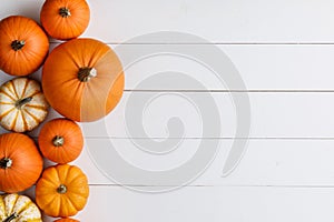 Pumpkins on rustic white wood