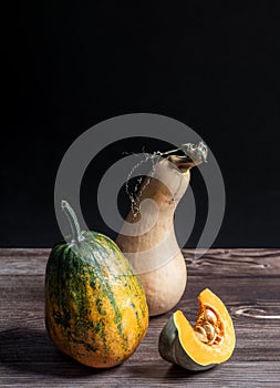 Pumpkins on a table at black background