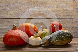 Pumpkins on a wooden autumn thanksgiving table