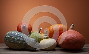 Pumpkins on a wooden autumn thanksgiving table