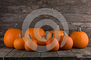 Pumpkins on wooden background