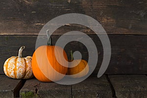 Pumpkins on wooden background