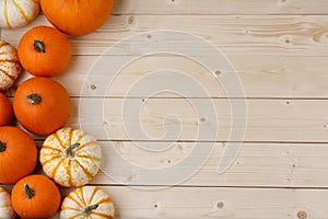 Pumpkins on wooden background