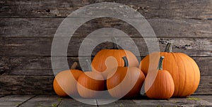 Pumpkins on wooden background