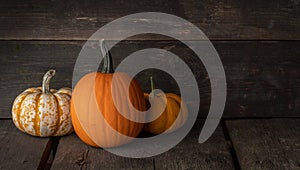 Pumpkins on wooden background