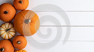 Pumpkins on wooden background