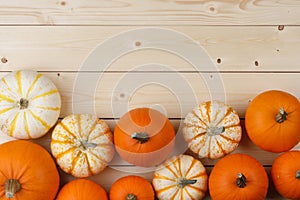 Pumpkins on wooden background