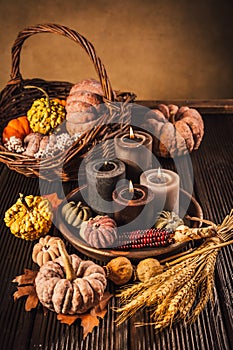 Pumpkins on wooden table - Thanksgiving, fall themed holiday table setting arrangement for a seasonal party