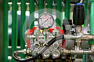 Pumps and pipe line for supplying water vapor and gas with pressure gauges . photo