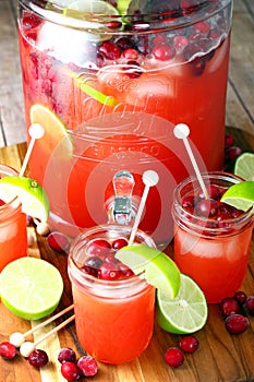 Punch bowl and glasses of cranberry pineapple punch