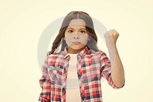 Punch you in your face. Stop bullying movement. Girl threatening with fist. Threatening physical attack. Kids aggression