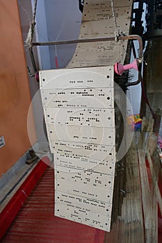 Punched cards that program a Jacquard loom