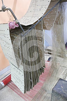 Punched cards that program a Jacquard loom