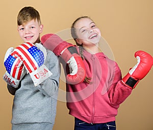 Punching knockout. Childhood activity. Sport success. Friendship fight. workout of small girl and boy boxer in