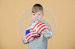 Punching knockout. Childhood activity. workout of small boy boxer. Sport success. Confident in his fitness regime