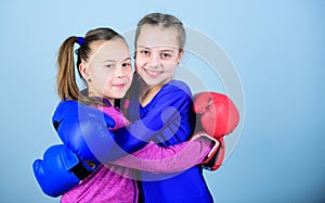 Punching knockout. Childhood activity. workout of small girls boxer in sportswear. Sport success. Friendship. Fitness