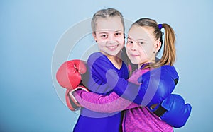 Punching knockout. Childhood activity. workout of small girls boxer in sportswear. Sport success. Friendship. Fitness