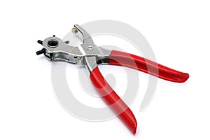 Punching plier with red handle on white