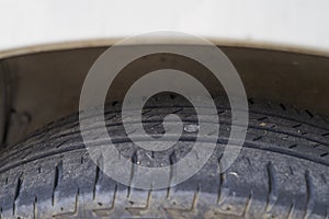 Punctured car tyre, flat tire. Nail or screw in the auto tyre